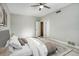 Main bedroom with plush bed and neutral color palette at 161 Overbrook W St, Largo, FL 33770