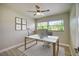 Home office with modern desk and large window at 161 Overbrook W St, Largo, FL 33770