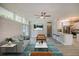 Open concept living room, featuring a white brick wall and modern decor at 161 Overbrook W St, Largo, FL 33770