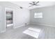 Bedroom with view into updated bathroom and hardwood floors at 161 Overbrook W St, Largo, FL 33770