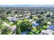 Aerial view of a residential neighborhood with lush green trees and houses at 161 Overbrook W St, Largo, FL 33770