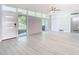 Open living area with light floors and white door at 161 Overbrook W St, Largo, FL 33770