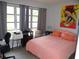 Cozy bedroom with a soft bed, warm colors, and natural light creating a peaceful atmosphere at 5 158Th Ave, Redington Beach, FL 33708