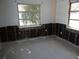 Room with large windows, showing water damage and exposed framing at 5 158Th Ave, Redington Beach, FL 33708