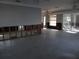 Large living room with wall removed, showing damage and exposed framing at 5 158Th Ave, Redington Beach, FL 33708