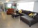 Inviting living area with a sectional, recliner, and plenty of natural light from large windows at 5 158Th Ave, Redington Beach, FL 33708