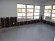 Bright living area with multiple windows and water damaged walls at 5 158Th Ave, Redington Beach, FL 33708