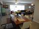 Open living area with a dining table, stylish decor, and bright natural lighting at 5 158Th Ave, Redington Beach, FL 33708