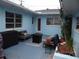 Cozy backyard patio with comfortable seating, lighting, and a relaxed outdoor setting at 5 158Th Ave, Redington Beach, FL 33708