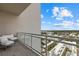 Private balcony features cozy seating and stunning cityscape views with lots of sunlight at 540 N Tamiami Trl # 1702, Sarasota, FL 34236