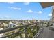 Balcony offering panoramic city views from a high-rise with a glass railing at 540 N Tamiami Trl # 1702, Sarasota, FL 34236