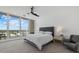 Bright bedroom with floor-to-ceiling windows offering scenic city views and a comfortable bed at 540 N Tamiami Trl # 1702, Sarasota, FL 34236
