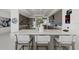 Modern kitchen featuring a large island with seating and stainless steel appliances at 540 N Tamiami Trl # 1702, Sarasota, FL 34236