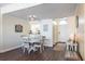 Bright dining room with round table and kitchen views at 7 Island Park Pl # 304, Dunedin, FL 34698