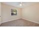 Bright bedroom with ceiling fan and neutral decor at 5733 66Th N Ln, St Petersburg, FL 33709