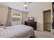 Bedroom with large closet and ceiling fan at 5733 66Th N Ln, St Petersburg, FL 33709