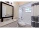 Clean bathroom with tub, shower, and white tile at 5733 66Th N Ln, St Petersburg, FL 33709