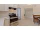 Eat-in kitchen features stainless steel appliances and tile flooring at 5733 66Th N Ln, St Petersburg, FL 33709