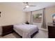 Bedroom with ceiling fan, window, and double dresser at 5733 66Th N Ln, St Petersburg, FL 33709