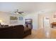 Living room with L-shaped sectional sofa and hallway view at 5733 66Th N Ln, St Petersburg, FL 33709