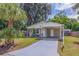 Newly renovated home with carport and landscaped yard at 5733 66Th N Ln, St Petersburg, FL 33709