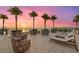 Spacious patio with lounge chairs and sunset views at 540 N Tamiami Trl # 1702, Sarasota, FL 34236