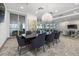 Bright dining room with a large table, modern chairs, and water views at 540 N Tamiami Trl # 1702, Sarasota, FL 34236