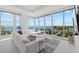 Bright living room with floor to ceiling windows and water views at 540 N Tamiami Trl # 1702, Sarasota, FL 34236
