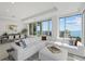 Spacious living room with large windows, city views, and ample seating at 540 N Tamiami Trl # 1702, Sarasota, FL 34236