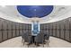 Elegant wine room with circular table and individual wine lockers at 540 N Tamiami Trl # 1702, Sarasota, FL 34236