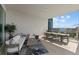 Outdoor balcony with seating area and water views at 540 N Tamiami Trl # 1702, Sarasota, FL 34236