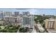 Aerial view of a modern high rise building with water and city views at 540 N Tamiami Trl # 1702, Sarasota, FL 34236