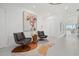 Elegant entryway with modern furniture and large artwork at 540 N Tamiami Trl # 1702, Sarasota, FL 34236