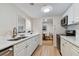 Modern kitchen with white cabinets, stainless steel appliances, and quartz countertops at 36750 Us Highway 19 N # 15305, Palm Harbor, FL 34684