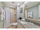 Bathroom with shower, granite vanity, and plenty of towels at 36750 Us Highway 19 N # 15305, Palm Harbor, FL 34684