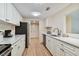 Modern kitchen with white cabinets and stainless steel appliances at 36750 Us Highway 19 N # 15305, Palm Harbor, FL 34684