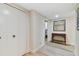 Hallway with tile floors, built in closets, and a console table at 36750 Us Highway 19 N # 15305, Palm Harbor, FL 34684