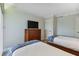 Two twin beds, dresser, and TV in a bright bedroom at 36750 Us Highway 19 N # 15305, Palm Harbor, FL 34684