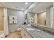 Bathroom with granite vanity, large mirror, and shower/tub combo at 36750 Us Highway 19 N # 15305, Palm Harbor, FL 34684