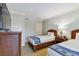 Two twin beds, a dresser, and TV in a comfortable bedroom at 36750 Us Highway 19 N # 15305, Palm Harbor, FL 34684
