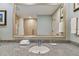 Bathroom vanity with granite countertop and large framed mirror at 36750 Us Highway 19 N # 15305, Palm Harbor, FL 34684