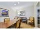 Dining area with wood table and chairs, features a nearby kitchen at 36750 Us Highway 19 N # 15305, Palm Harbor, FL 34684