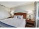 Bright bedroom with a comfortable queen-size bed and nightstands at 36750 Us Highway 19 N # 15305, Palm Harbor, FL 34684