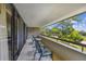 Spacious balcony with chairs and table overlooking the golf course at 36750 Us Highway 19 N # 15305, Palm Harbor, FL 34684