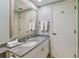 Bathroom with granite vanity, sink, and mirror at 36750 Us Highway 19 N # 15305, Palm Harbor, FL 34684
