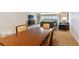 Dining area with a wood table and four chairs, overlooking living room at 36750 Us Highway 19 N # 15305, Palm Harbor, FL 34684