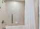 Clean bathroom with shower and tub, and grab bar at 36750 Us Highway 19 N # 15305, Palm Harbor, FL 34684