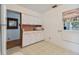Retro kitchen with white cabinets and pink countertops at 7979 Garden N Dr, St Petersburg, FL 33710