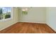 Light-filled bedroom with hardwood floors and a window at 7979 Garden N Dr, St Petersburg, FL 33710