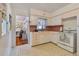 Retro kitchen with white cabinets and pink countertops at 7979 Garden N Dr, St Petersburg, FL 33710